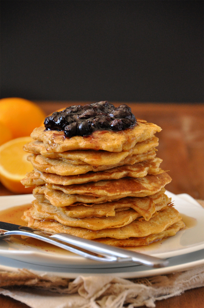 Whole Grain Griddle Cakes with Blueberry & Orange Compote Giant stack of Whole Wheat Griddle Cakes topped with Blueberry Orange Compote