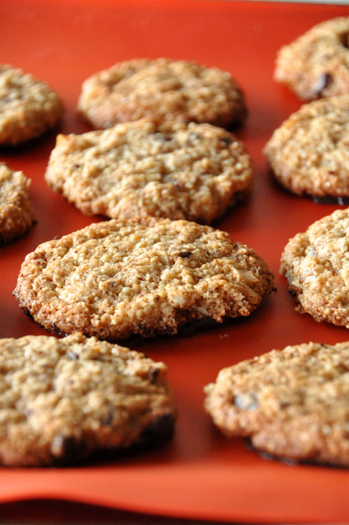 Batch of our Gluten-Free Bourbon Caramel Samoas recipe on a bright orange background