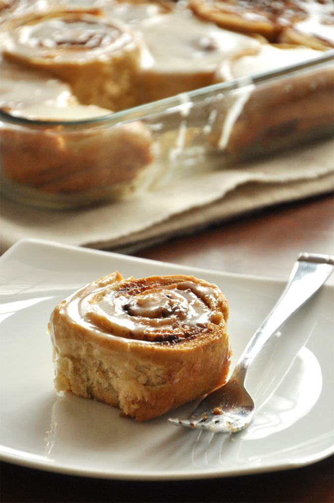 Overnight Cinnamon Rolls | Minimalist Baker Delicious Overnight Honey Wheat Cinnamon Rolls on a plate and in a baking pan
