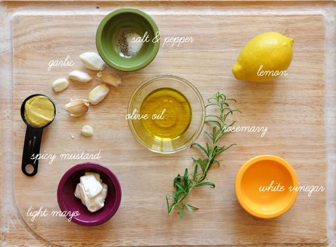 Cutting board with ingredients for making Rosemary Caesar Dressing