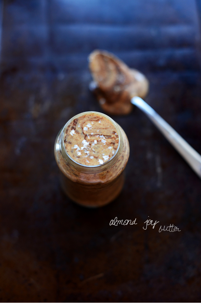 Jar and spoon filled with our vegan Almond Joy Nut Butter Spread