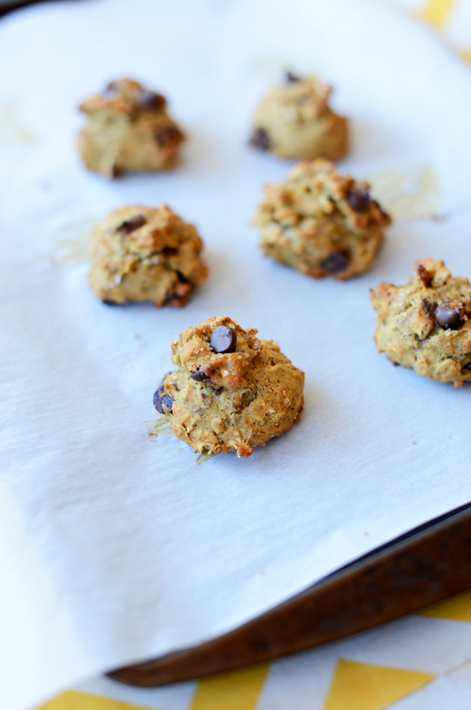 Parchment-lined baking sheet with Chocolate Chip Banana Bread Bites
