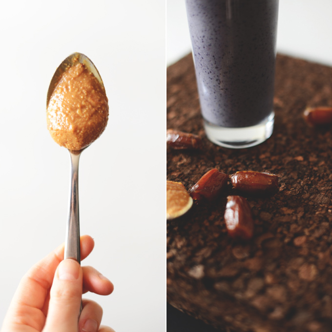 Spoonful of peanut butter and a smoothie glass surrounded by dates