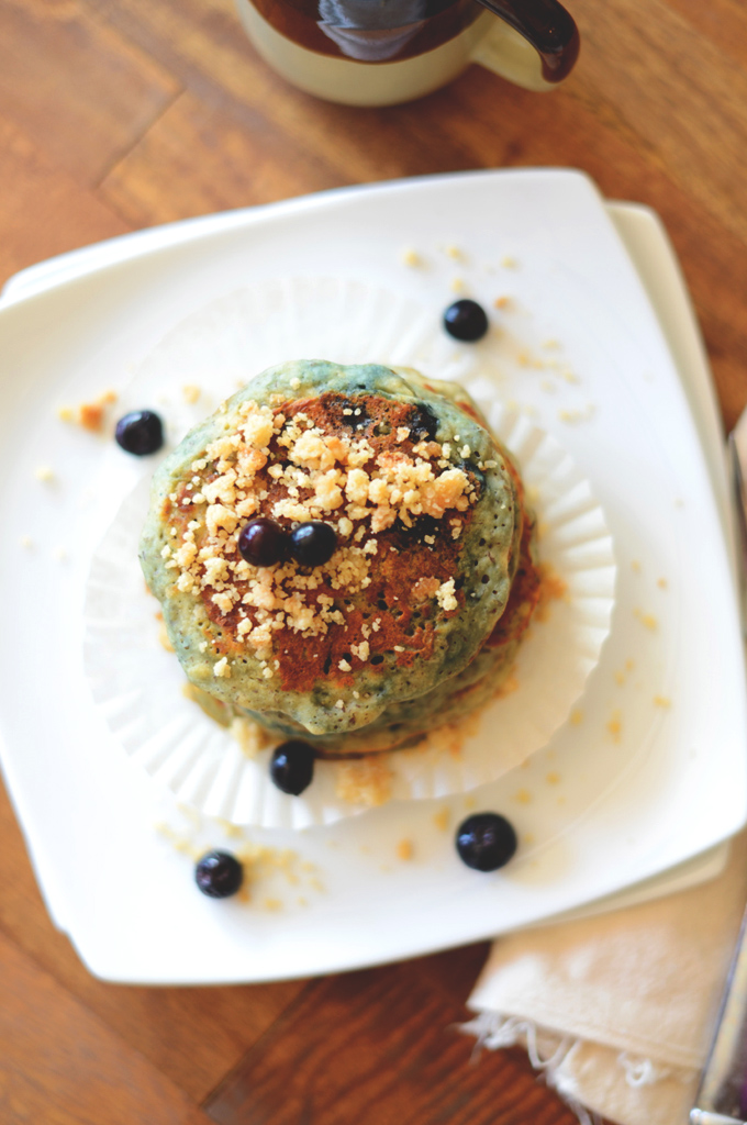 Stack of Vegan Blueberry Muffin Pancakes topped with fresh blueberries