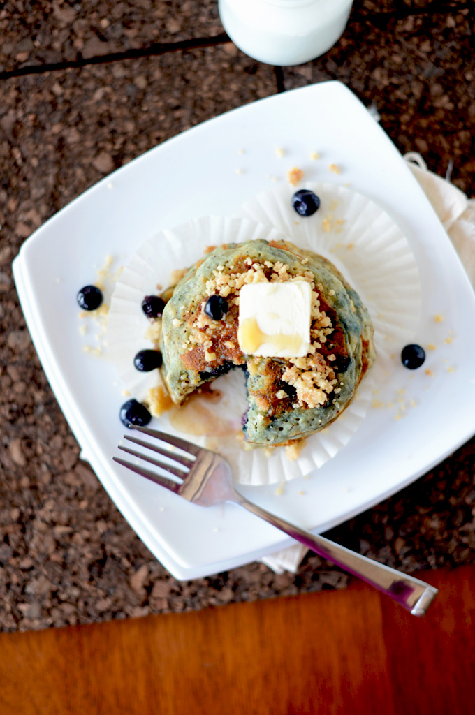Plate with a stack of vegan Blueberry Muffin Pancakes with a bite removed