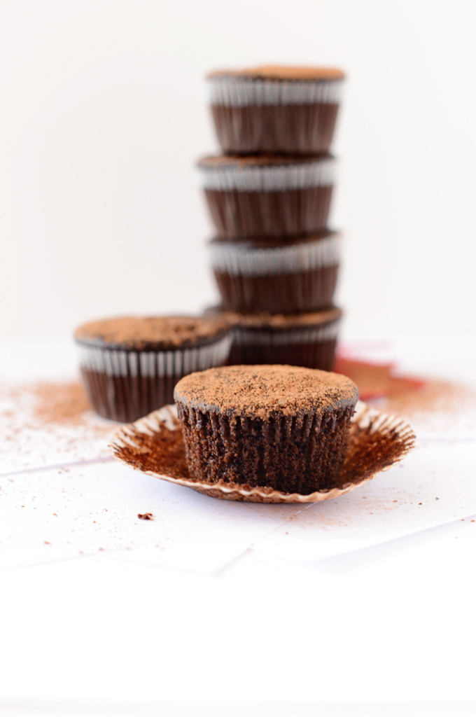 Close up shot of a Vegan Chocolate Beet Cupcake sprinkled with cocoa powder