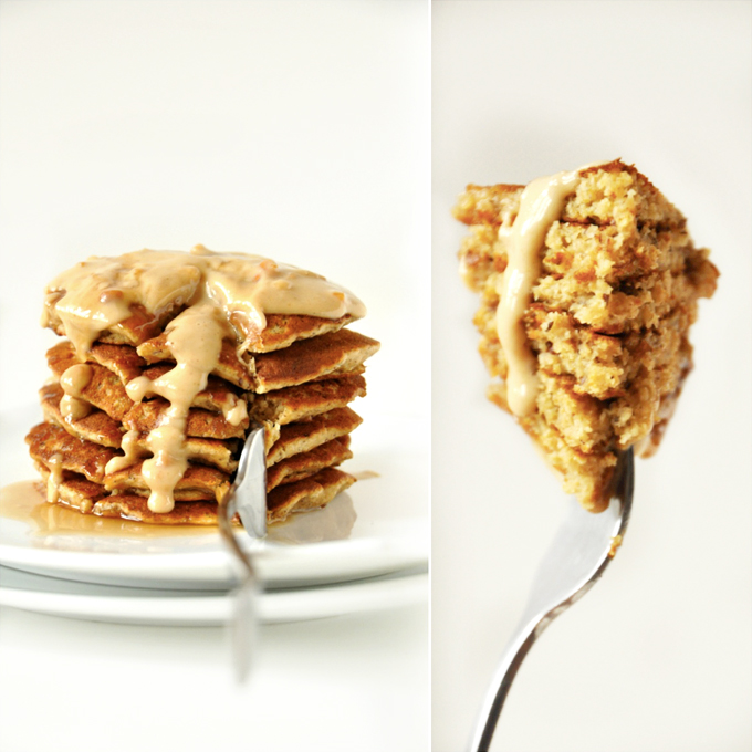 Holding up a stacked bite of Vegan Peanut Butter Pancakes covered in syrup