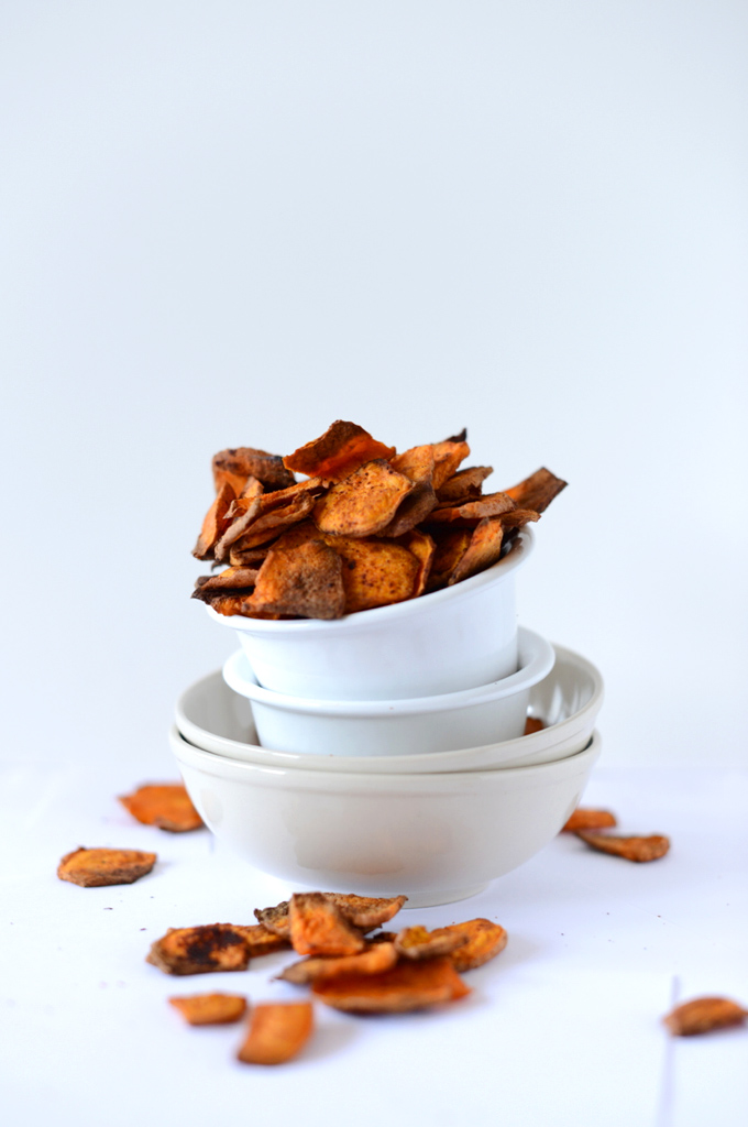 Stack of bowls with the top one filled with our Chipotle Sweet Potato Chips recipe