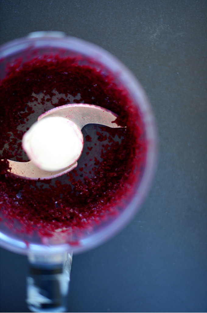 Food processor with pureed beets for making our Roasted Beet Hummus recipe