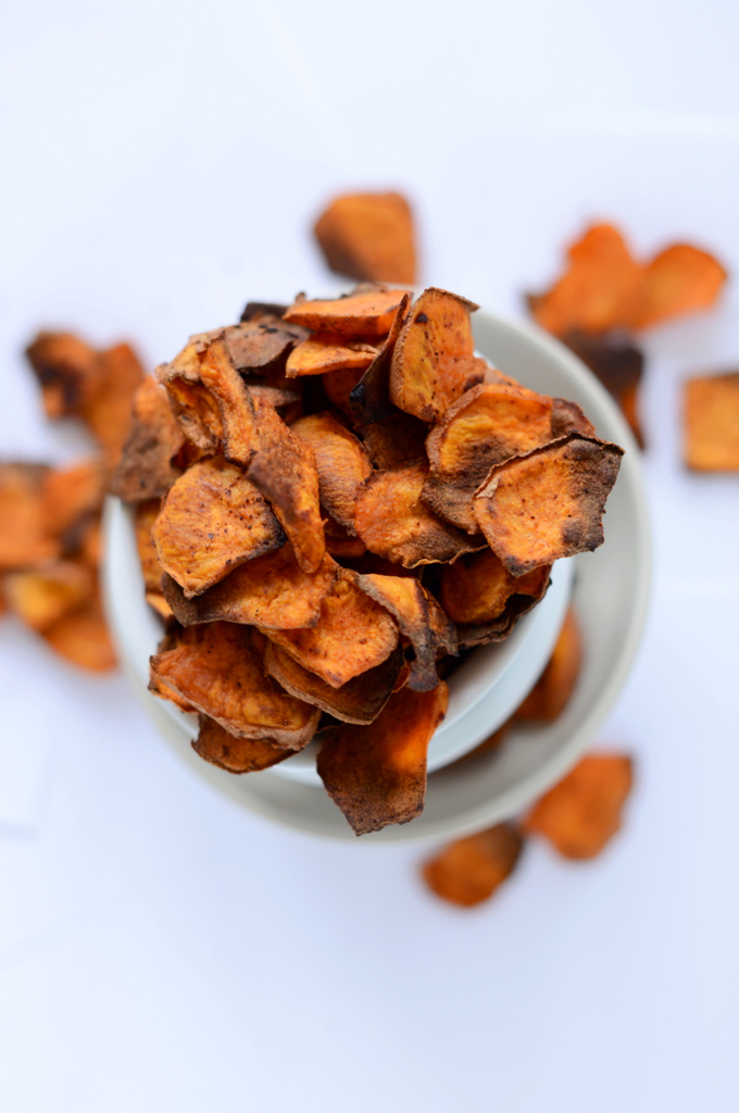 Bowl overflowing with a batch of our Spicy Sweet Potato Chips