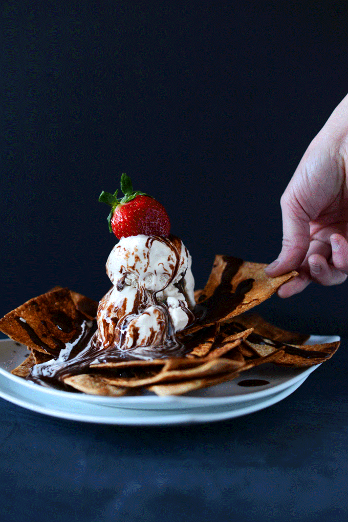 Using a dessert nacho to grab a bite of Vegan Ice Cream