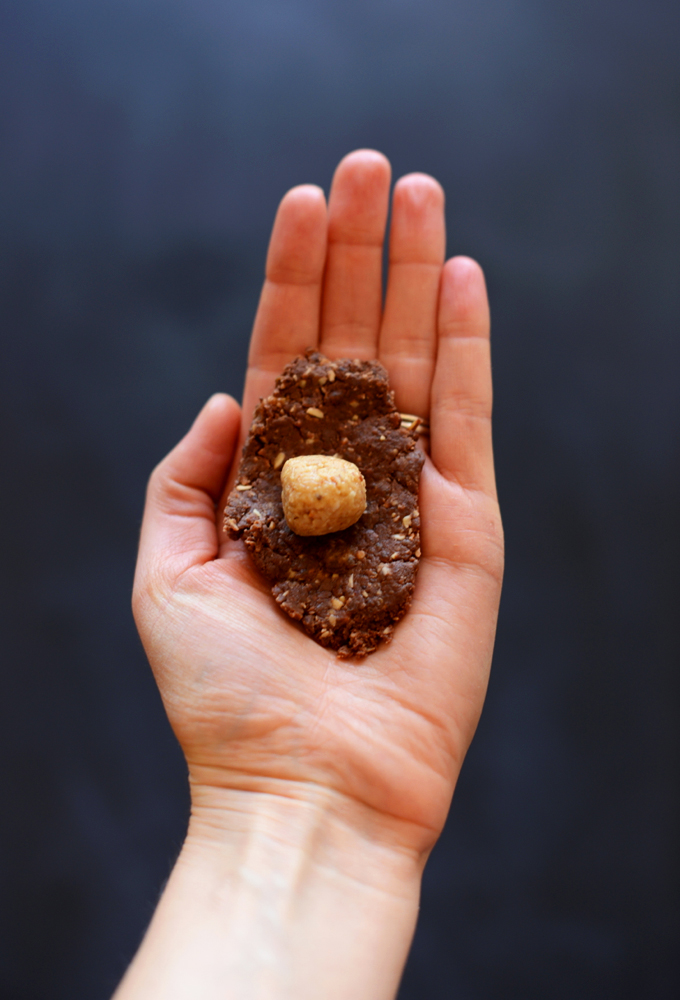 Coating a ball of peanut butter in No-Bake Chocolate Cookie dough