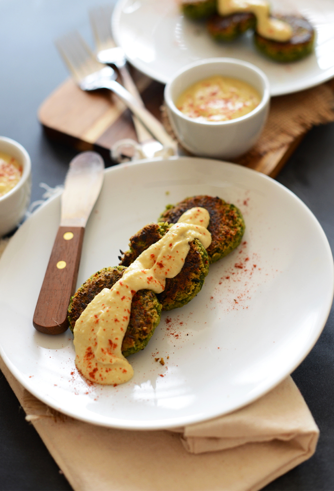 Plate of Healthy Green Falafel topped with hummus and paprika
