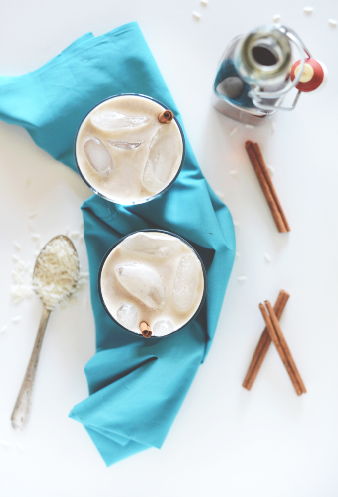 Two glasses of homemade Horchata on a blue kitchen towel
