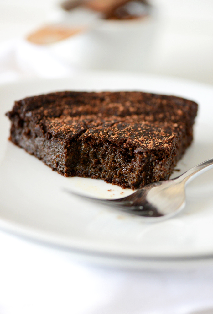 Plat with a slice of Fudgy Gluten-Free Chocolate Cake