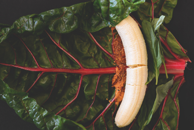 Peanut butter and banana on a rainbow chard leaf
