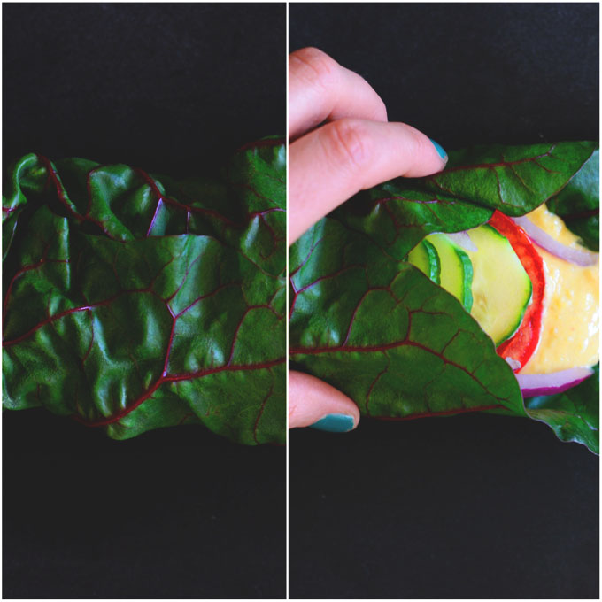 Holding a Hummus Rainbow Chard Wrap
