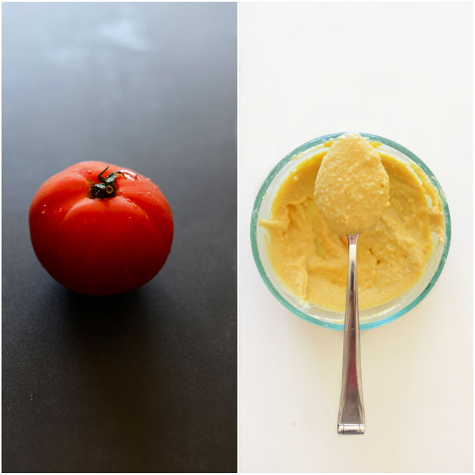 Fresh tomato and a bowl of hummus for making chard wraps