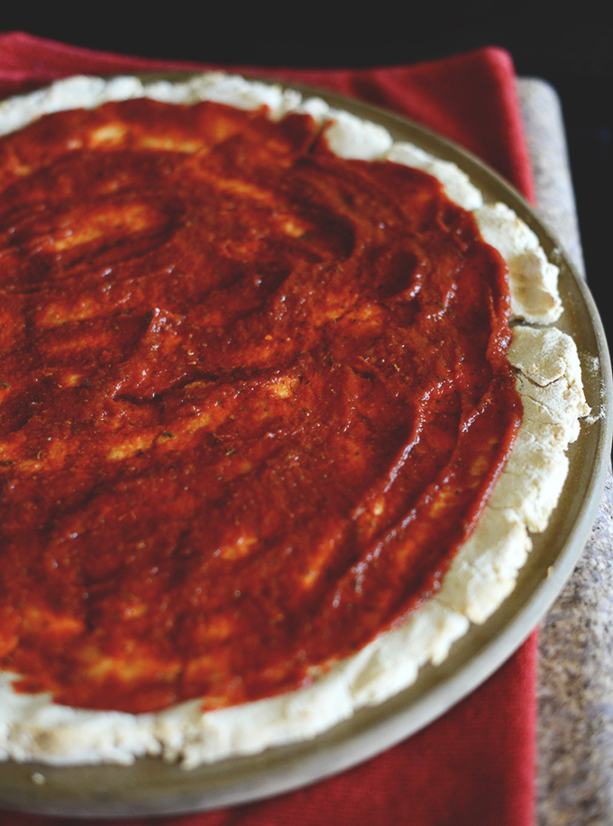 Homemade pizza crust spread onto amazing Gluten-Free Pizza Dough