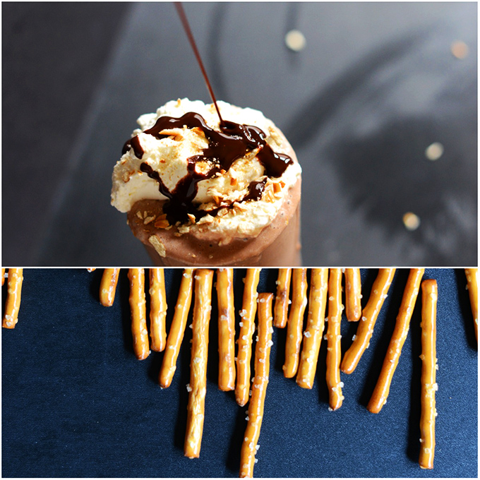 Drizzling chocolate sauce onto a Pretzel Frozen Hot Chocolate