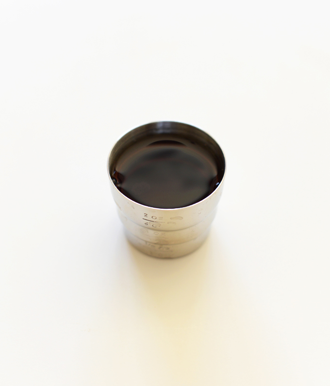 Shaker lid filled with rum