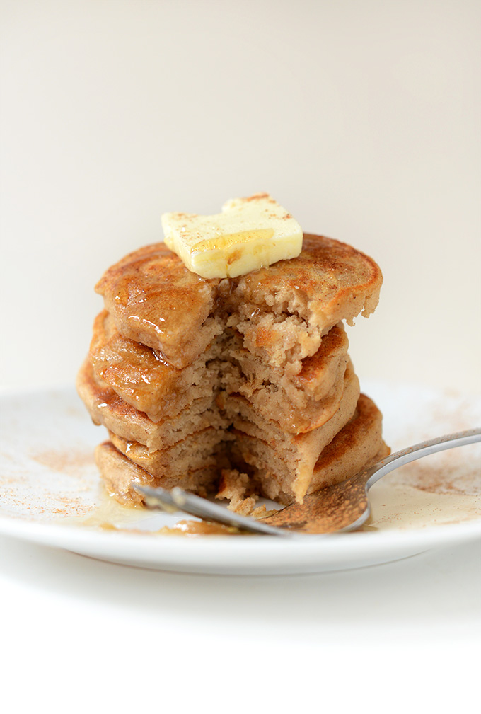 Stack of Fluffy Dairy-Free Sopapilla Pancakes with a slice removed