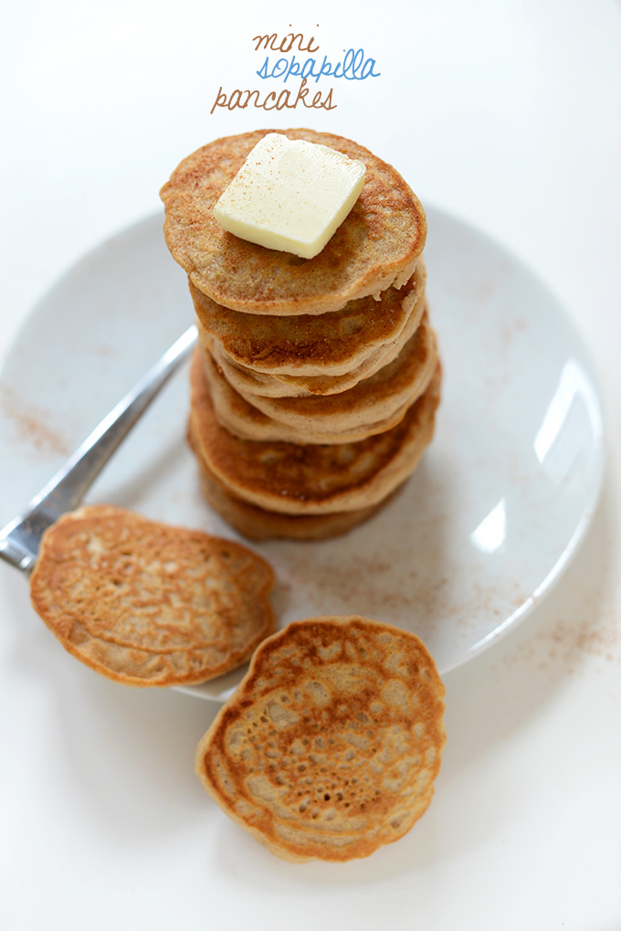 Giant stack of Mini Sopapilla Pancakes topped with butter