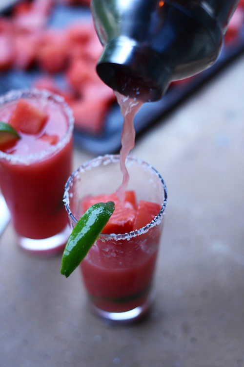 Pouring a Watermelon Lime Margarita for a refreshing homemade drink
