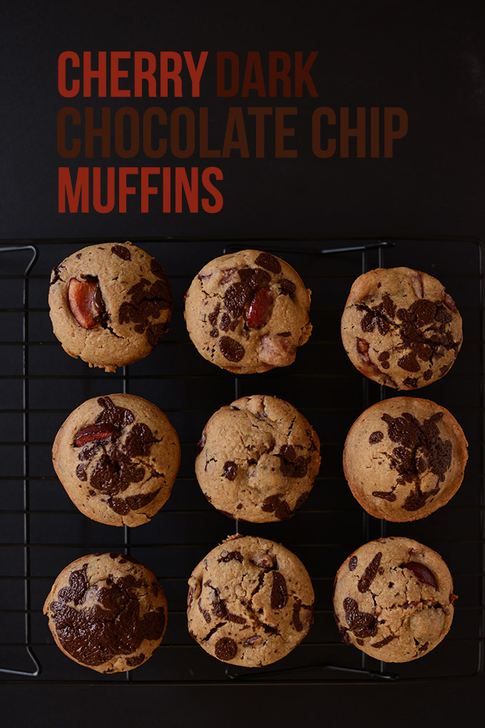 Batch of vegan Cherry Dark Chocolate Chip Muffins on a cooling rack