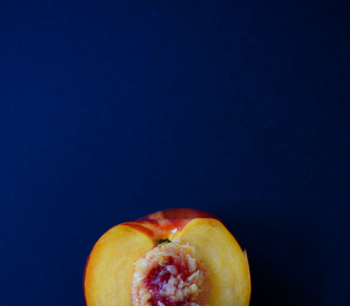 Halved fresh nectarine for making a homemade crisp