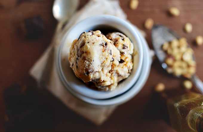 Bowls stacked high with scoops of Vegan Snickers Ice Cream at the top