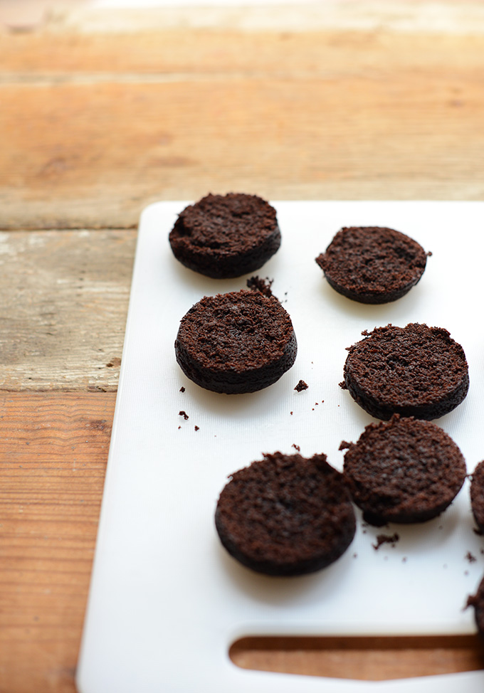 Circular brownies on a cutting board for making Brownie Ice Cream Sandwiches