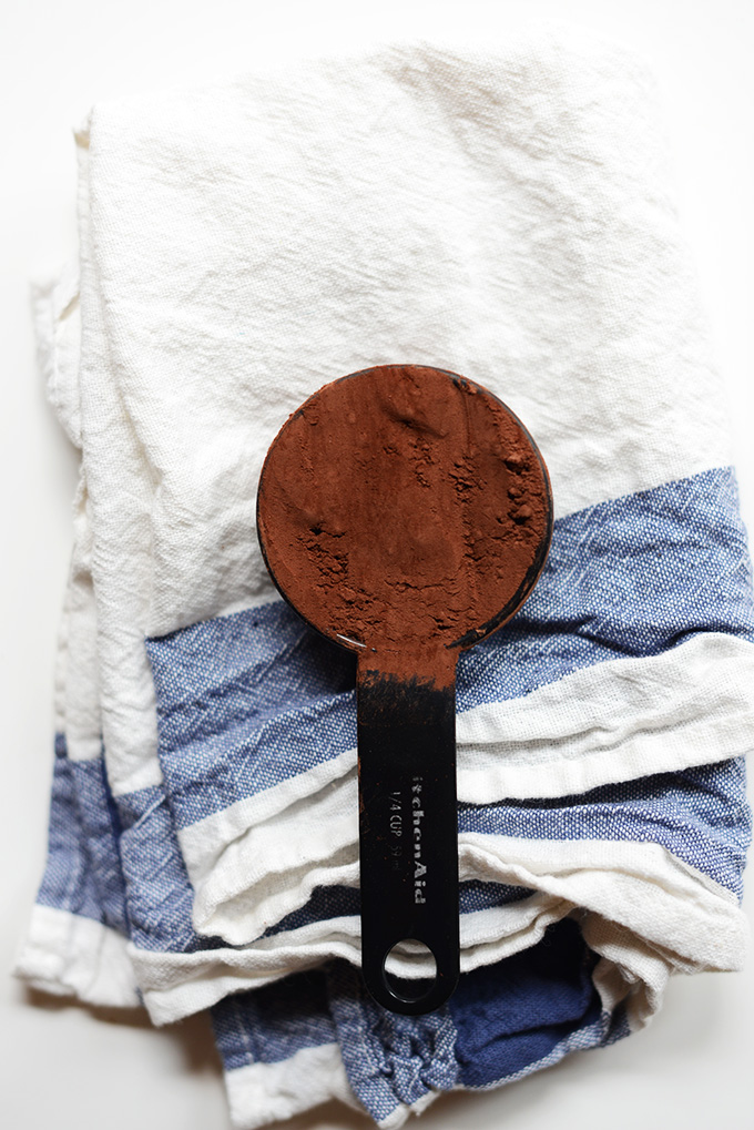 Measuring spoon filled with Dutch Process Cocoa Powder for making Vegan Brownies