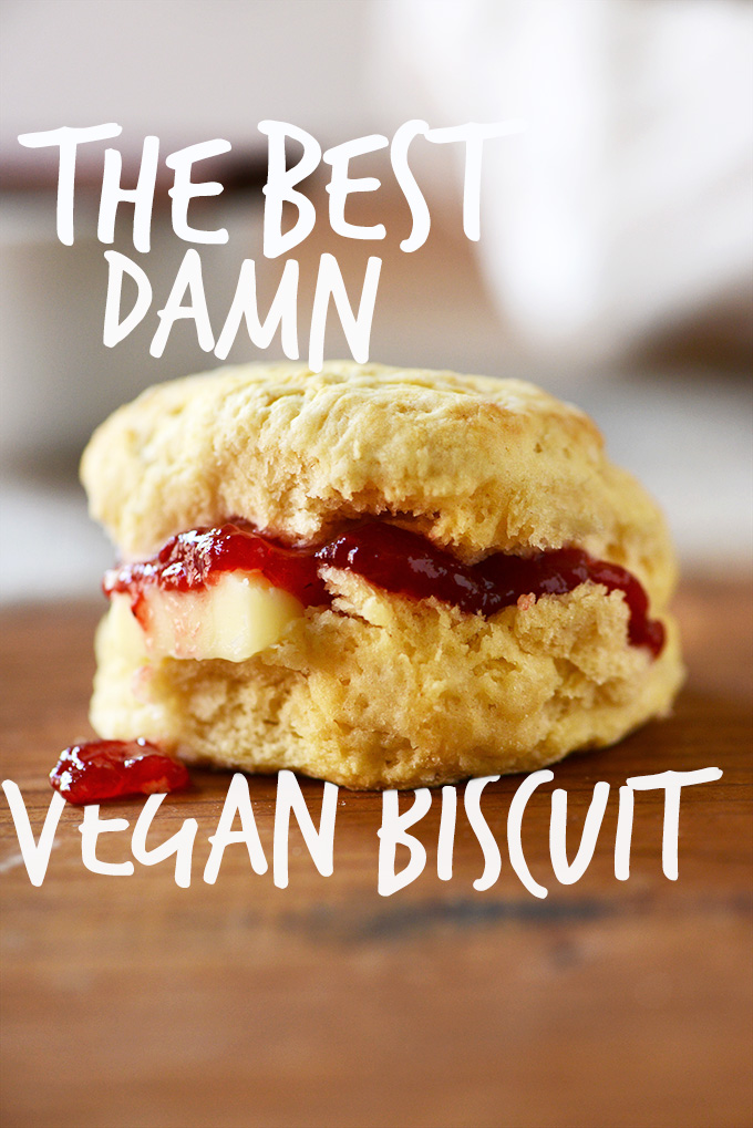 Vegan biscuit sliced open with jam and vegan butter inside