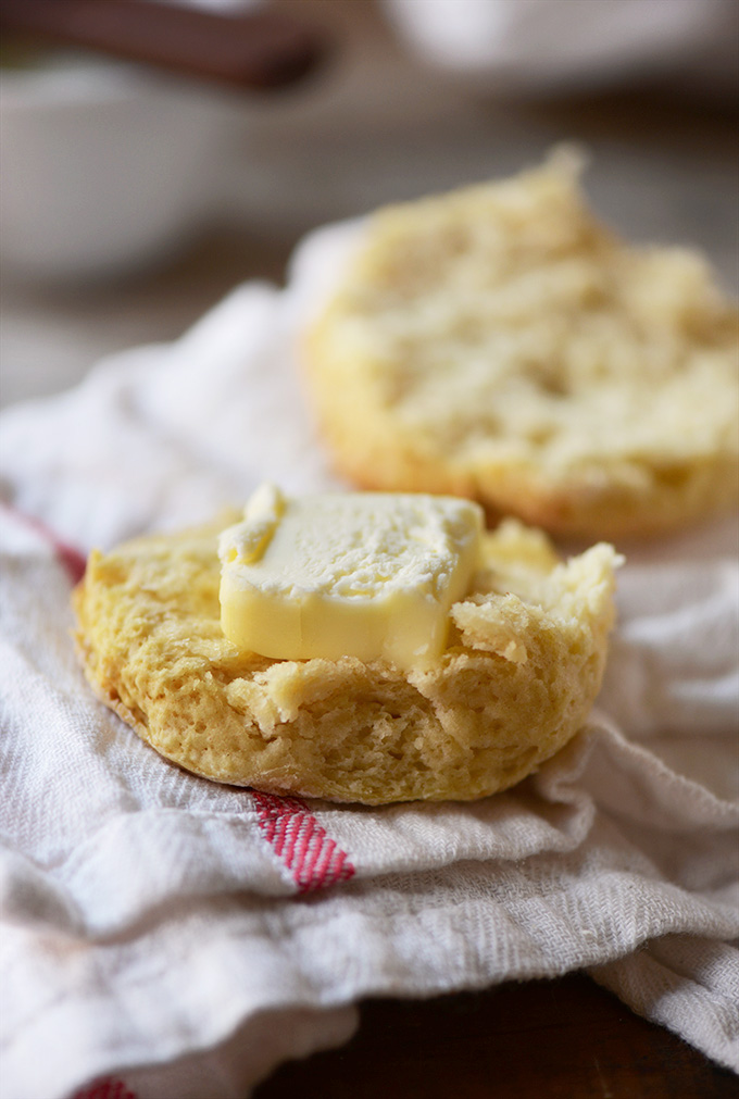 Sliced open biscuit with a slab of vegan butter