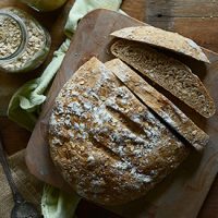 Partially sliced loaf of Easy Homemade Wheat Bread