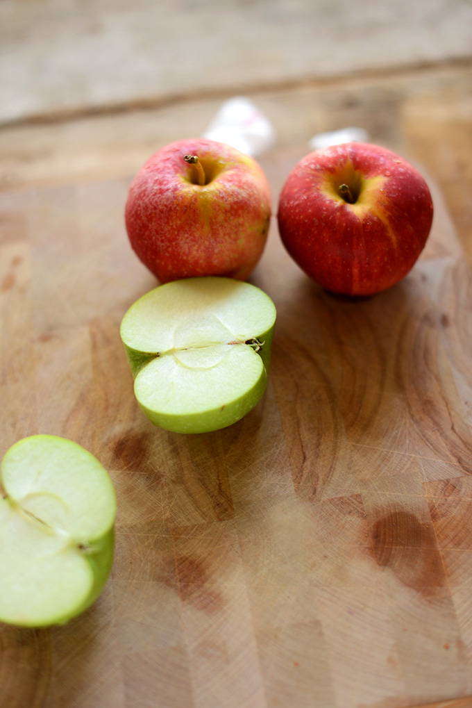 Whole and halved fresh apples for making Apple French Toast