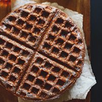 Top down shot of a Blue Cornmeal Waffle on a napkin