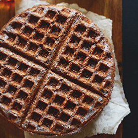 Top down shot of a Blue Cornmeal Waffle on a napkin