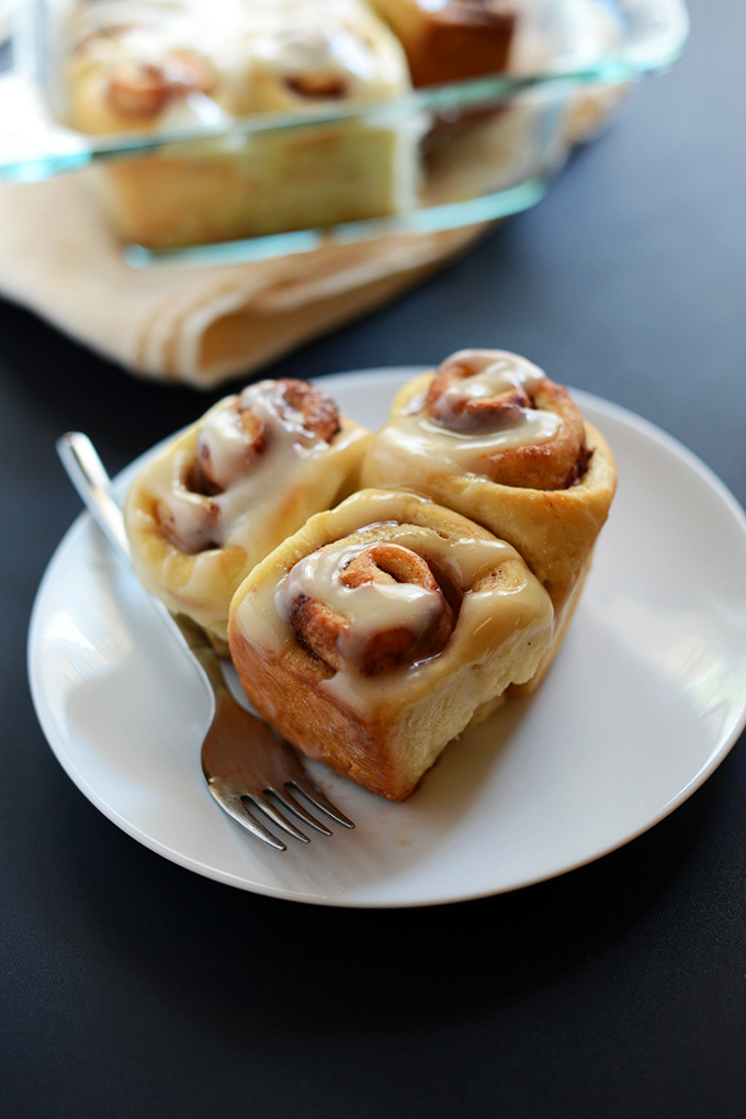 Plate of Cinnamon Rolls with Vegan Cream Cheese Icing