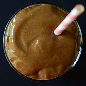 Straw in a tall glass of our Triple Chocolate Avocado Shake