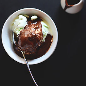Bowl of mint chip ice cream covered in Vegan Kahlua Hot Fudge