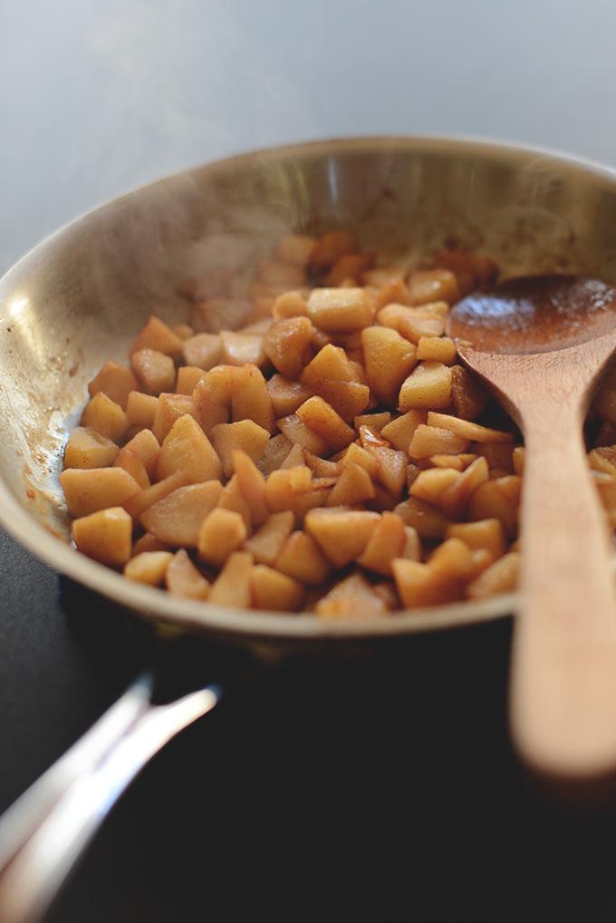 Cooking Cinnamon Apples in a pan for adding to waffles