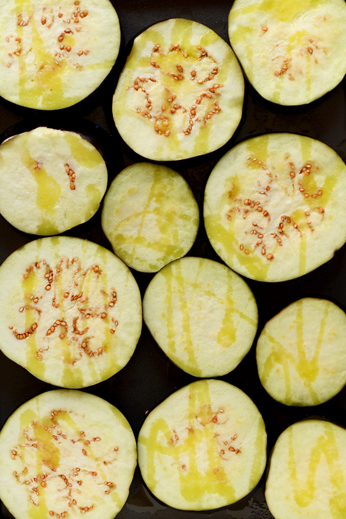 Slices of Roasted Eggplant drizzled with olive oil for making Persian Eggplant Dip