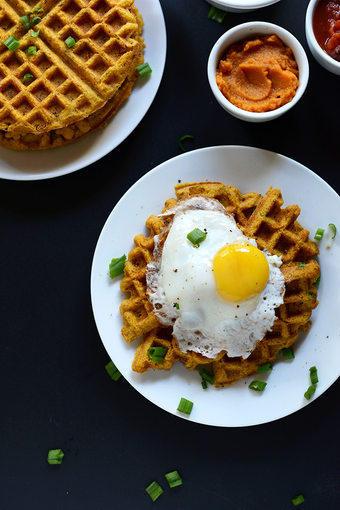 Plate of a Savory Pumpkin Cornbread Waffle topped with a fried egg