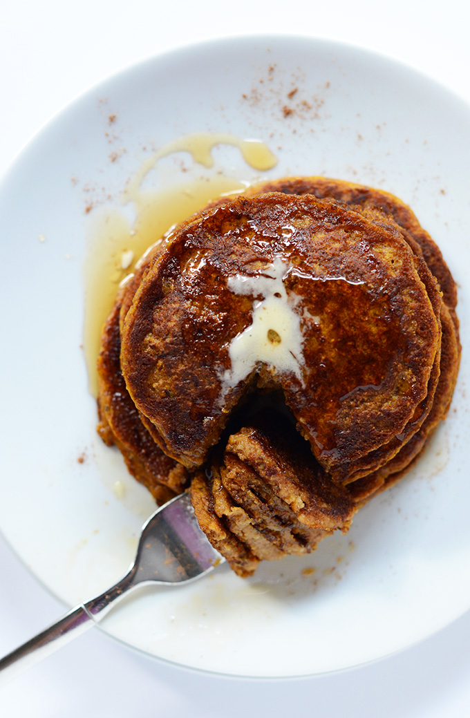 Grabbing a bite of super moist Vegan Pumpkin Pancakes