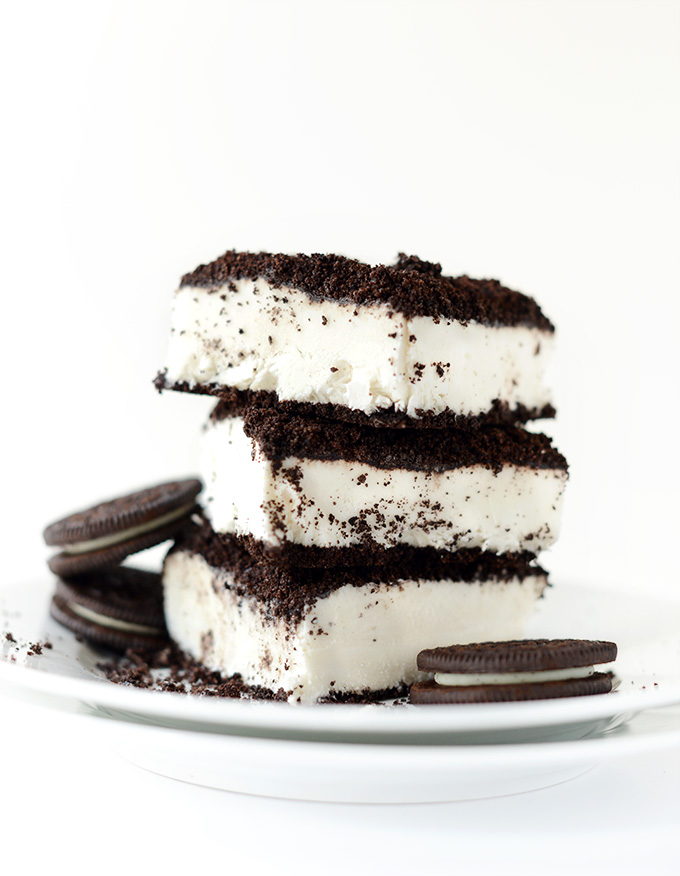 Stack of Vegan Dirt Cake slices alongside oreo cookies