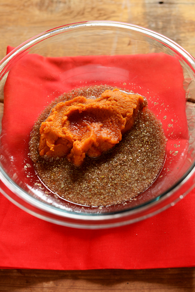 Mixing bowl with flax and pumpkin puree for making our Vegan Pumpkin Bread recipe