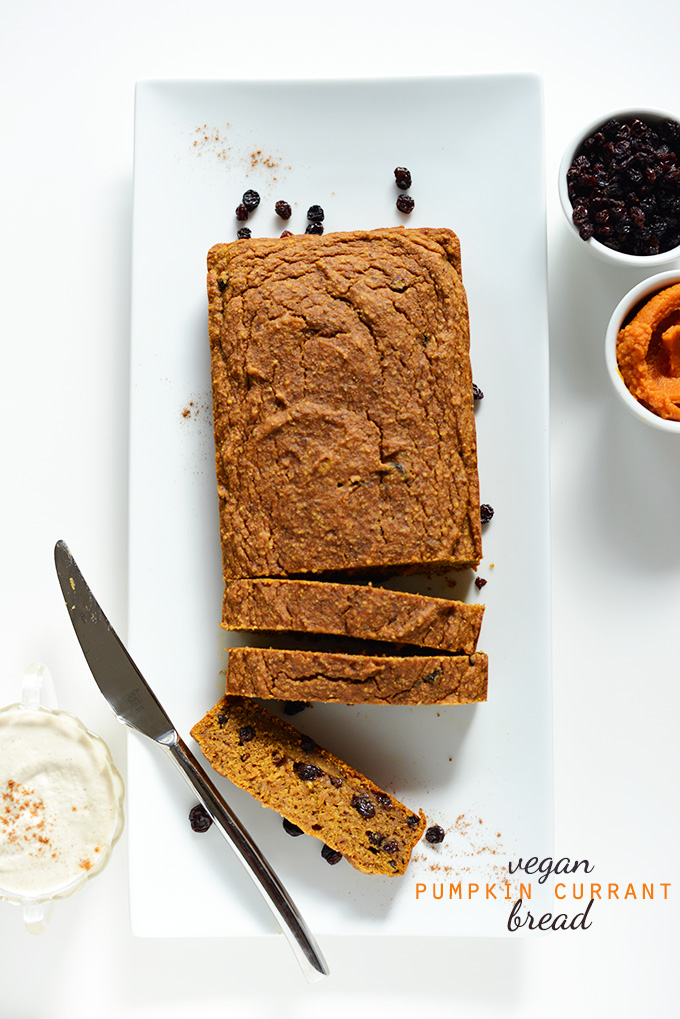 Partially sliced loaf of Vegan Pumpkin Currant Bread
