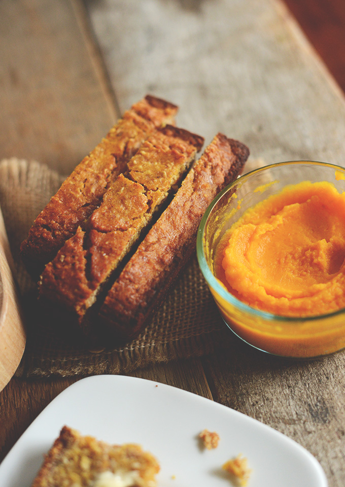 Slices of Gluten-Free Butternut Squash Bread alongside a bowl of squash puree